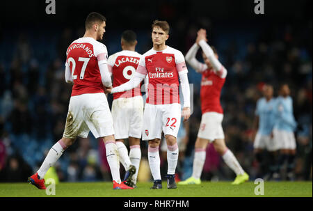 Arsenal's (left-right) Konstantinos Mavropanos and Denis Suarez react after the final whistle during the Premier League match at the Etihad Stadium, Manchester. Stock Photo
