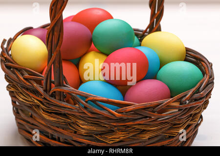 Many Easter colored eggs in the basket. Close-up Stock Photo