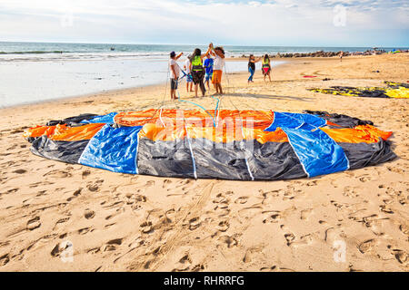 Mazatlan, Mexico-10 December, 2018: A group of diverse young men learning kite surfing in Golden Zone (Zona Dorada), a famous touristic beach and reso Stock Photo