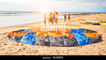 Mazatlan, Mexico-10 December, 2018: A group of diverse young men learning kite surfing in Golden Zone (Zona Dorada), a famous touristic beach and reso Stock Photo