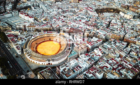 Aerial view of the Plaza de Toros de Sevilla, drone shot of the bull ring in Seville with people in it Stock Photo