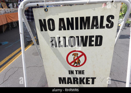 Close up of a sign which says 'No Animals Allowed in the Market' with a picture of a dog. This is in the Farmer's Market in Montrose, near Los Angeles Stock Photo