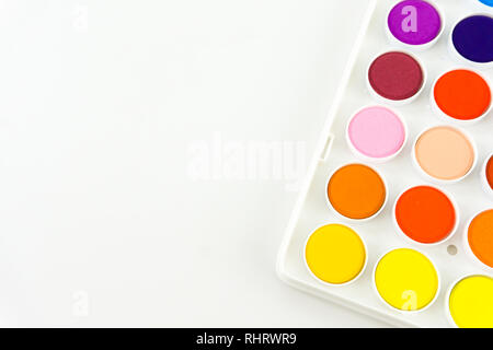 These colorful dots are close up of watercolor pans in a white palette - a rainbow of dots making a beautiful abstract pattern. Creative and cheerful Stock Photo