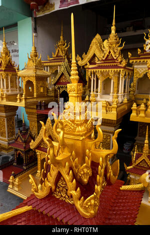 Cambodia, Phnom Penh, Preah Norodom Boulevard, Buddhist spirit houses on display outside shop Stock Photo