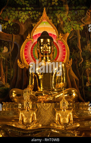 Cambodia, Phnom Penh, Wat Botum, inside Temple of Lotus Blossoms, gilded sitting and reclining Buddha figures at altar of main Prayer Hall Stock Photo