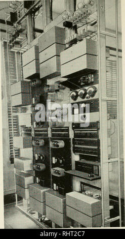 . The Bell System technical journal. Telecommunication; Electric engineering; Communication; Electronics; Science; Technology. 208 BELL SYSTEM TECHNICAL JOURNAL I ' &quot;1. Pig 9 Carrier terminal apparatus at Key West.. Please note that these images are extracted from scanned page images that may have been digitally enhanced for readability - coloration and appearance of these illustrations may not perfectly resemble the original work.. American Telephone and Telegraph Company. [Short Hills, N. J. , etc. , American Telephone and Telegraph Co. ] Stock Photo