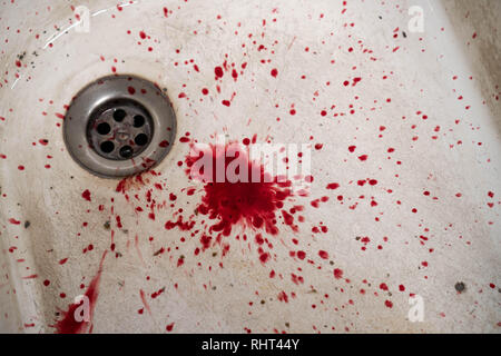 Bloody in sink with flowing red blood. Murder concept background Stock Photo