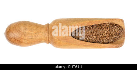 Cumin or caraway seeds in wooden spoon isolated on white background. Top view Stock Photo