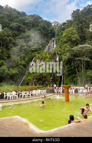 SANTA ROSA DE CABAL, COLOMBIA - JUNE 2: People in the hot springs of Santa Rosa de Cabal, Colombia with a waterfall in the background on June 2, 2016 Stock Photo