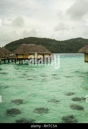 View of the over-water bungalows at Pearl Beach Resort in Bora Bora Stock Photo