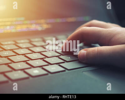 Closeup programmer coding on screen. Hands coding html and programming on laptop screen, web development, developer Stock Photo