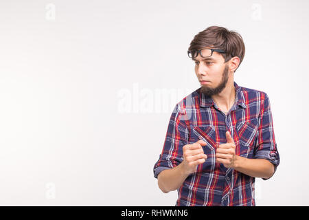 Expression and gesture concept - young bearded man in plaid shirt over white background with copy space Stock Photo