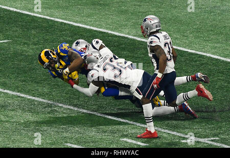 Atlanta. 3rd Feb, 2019. Los Angeles Rams' Todd Gurley is tackled (1st L) during the NFL Super Bowl LIII football game between New England Patriots and Los Angeles Rams in Atlanta, the United States, Feb. 3, 2014. New England Patriots won 13-3. Credit: Xinhua/Alamy Live News Stock Photo