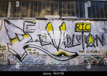Paris, Ile de France, France. 3rd Feb, 2019. Grafitti representing the word 'Revolution'. 20 artists from the Black Lines movement directed a 300 meter fresco on a wall of rue d'Aubervilliers in the 19th district (arrondissement) of Paris, on the theme of the Yellow Vests movement. Credit: Thierry Le Fouille/SOPA Images/ZUMA Wire/Alamy Live News Stock Photo