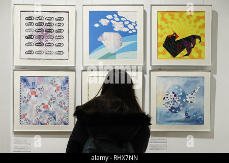 Brussels, Belgium. 4th Feb, 2019. A visitor watches the Chinese zodiac exhibition in the China Cultural Center in Brussels, Belgium, Feb. 4, 2019. A set of activities such as performances, Chinese zodiac exhibition, calligraphy, etc., attracted some 200 visitors from across Europe to celebrate the Chinese Spring Festival in the center. Credit: Zheng Huansong/Xinhua/Alamy Live News Stock Photo