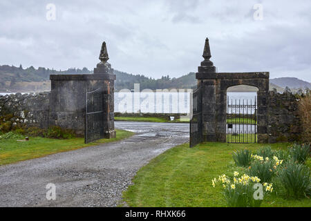 THE ARDCHATTAN PRIORY GARDENS 1st May 2018 Stone Gates at the entrance looking through to Loch Etive Stock Photo