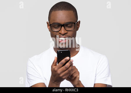 Happy young african man using smartphone gadget social media apps Stock Photo