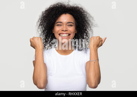 Excited overjoyed african teen girl student winner looking at laptop ...