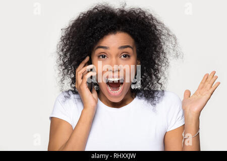 Excited overjoyed african teen girl student winner looking at laptop ...