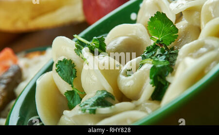 Chuchpara, kind of dumpling, which is popular in Central Asia, Kyrgyz  cuisine, Traditional assorted dishes, Top view. Stock Photo