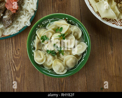 Chuchpara, kind of dumpling, which is popular in Central Asia, Kyrgyz  cuisine, Traditional assorted dishes, Top view. Stock Photo