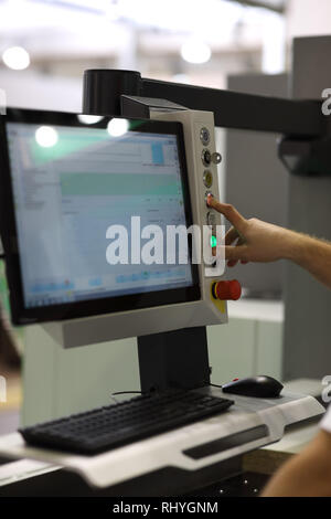 Operator controls the work of modern computerized equipment. Selective focus. Stock Photo