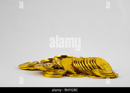 Golden bitcoins on white background. Bitcoin cryptocurrency Stock Photo