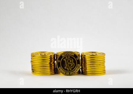 Golden bitcoins on white background. Bitcoin cryptocurrency Stock Photo