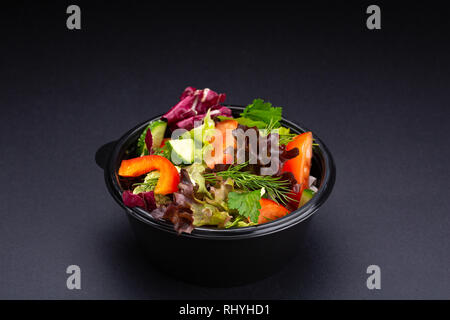 Vegetables and herbs plate mix snack without sauce on black background Stock Photo