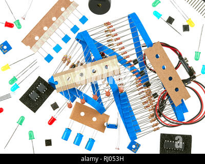 A selection of active and passive electronics components: buttons, LEDs, resistors, capacitors, buzzer, connecting wires, transistors and integrated c Stock Photo