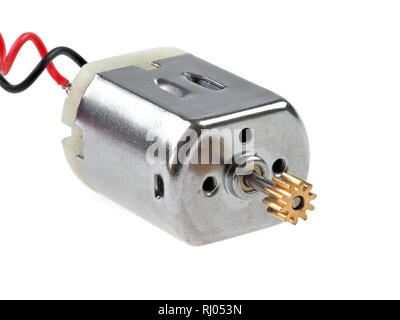 Small size direct current motor, with red and black wires, isolated on white. The kind of motor used in many electronics and student projects. Stock Photo