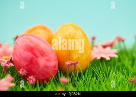 Three colorfully painted easter eggs as easter background decoration Stock Photo