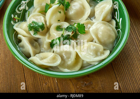 Chuchpara, kind of dumpling, which is popular in Central Asia, Kyrgyz  cuisine, Traditional assorted dishes, Top view. Stock Photo