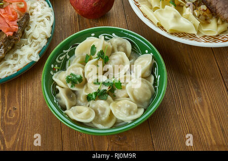 Chuchpara, kind of dumpling, which is popular in Central Asia, Kyrgyz  cuisine, Traditional assorted dishes, Top view. Stock Photo