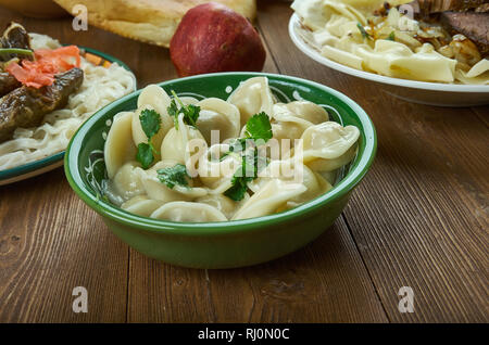 Chuchpara, kind of dumpling, which is popular in Central Asia, Kyrgyz  cuisine, Traditional assorted dishes, Top view. Stock Photo