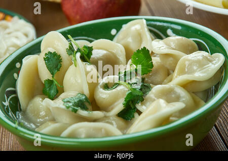 Chuchpara, kind of dumpling, which is popular in Central Asia, Kyrgyz  cuisine, Traditional assorted dishes, Top view. Stock Photo