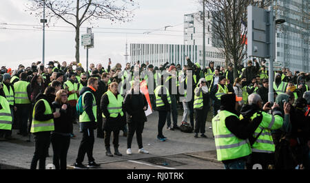 STRASBOURG, FRANCE - FEB 02, 2018: Police and protesters in front of Adidas headquarter during Yellow Vest prottest