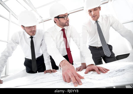 group of architects discussing sketches Stock Photo