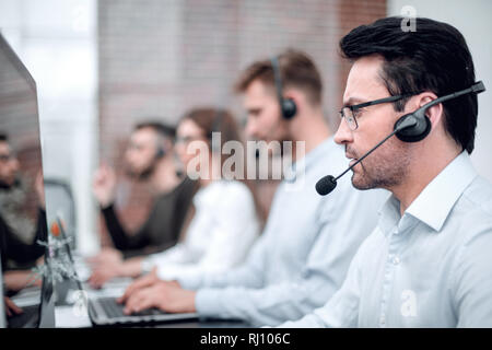 technical support specialist on the background of colleagues Stock Photo