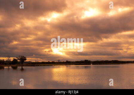 Stormy clouds over lake in New Forest countryside