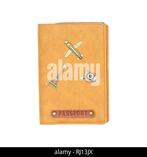 Cover on the passport isolated on white background. International leather passport cover with travel items decoration. Stock Photo