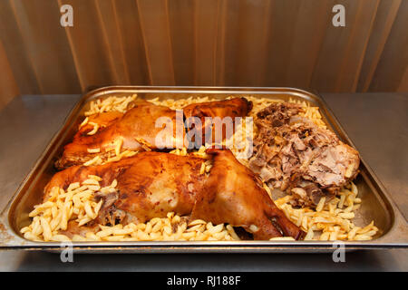 a beautiful roast suckling pig on the buffet in hotel restaurant Stock Photo