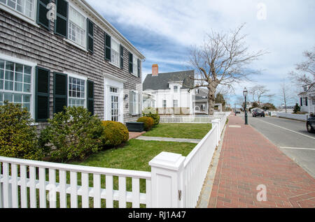 Edgartown, MA - April 5, 2018: Typical homes on Martha's Vineyard, known for their unique architecture and brick sidewalks Stock Photo