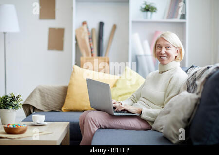 Mature Woman Using Laptop Stock Photo