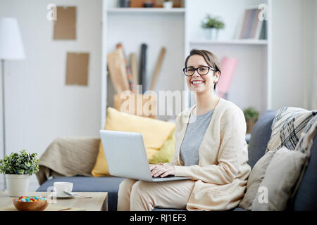 Smiling Businesswoman Using Laptop Stock Photo