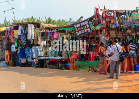 Colourful clothes stalls Anjuna’s weekly Wednesday flea market,  Goa, India Stock Photo