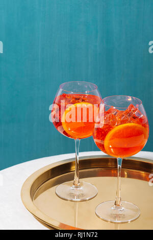 Spritz veneziano, an IBA cocktail, with Prosecco or white sparkling wine, bitter, soda, ice and a slice of orange, in a calix on a table, pop graphic Stock Photo