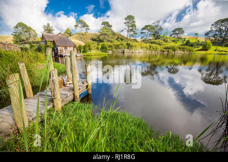 MataMata, New Zealand -  March 2017 Hobbit house and the old Mill beside an old stony bridge Hobbiton