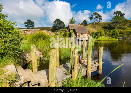 MataMata, New Zealand -  March 2017 Hobbit house and the old Mill beside an old stony bridge Hobbiton