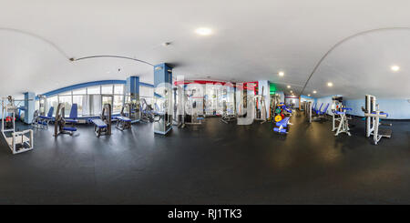 360 degree panoramic view of MINSK, BELARUS - JUNE 2017: panorama 360 angle view in interior big stylish fitness club with sport simulators. Full spherical 360 degrees seamless pa